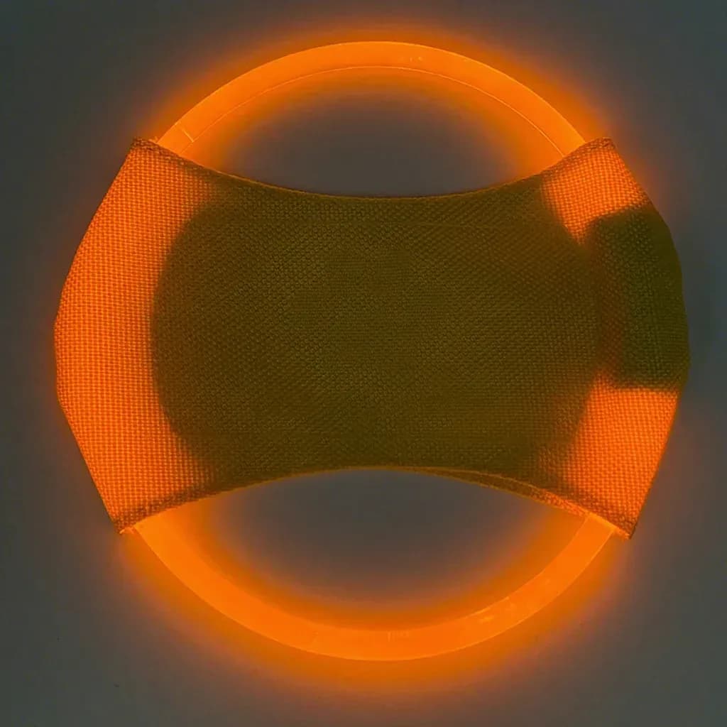 LED dog flying disc glowing yellow