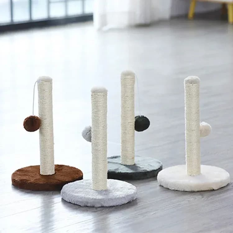 sisal cat scratching posts with plush bases on a wooden floor