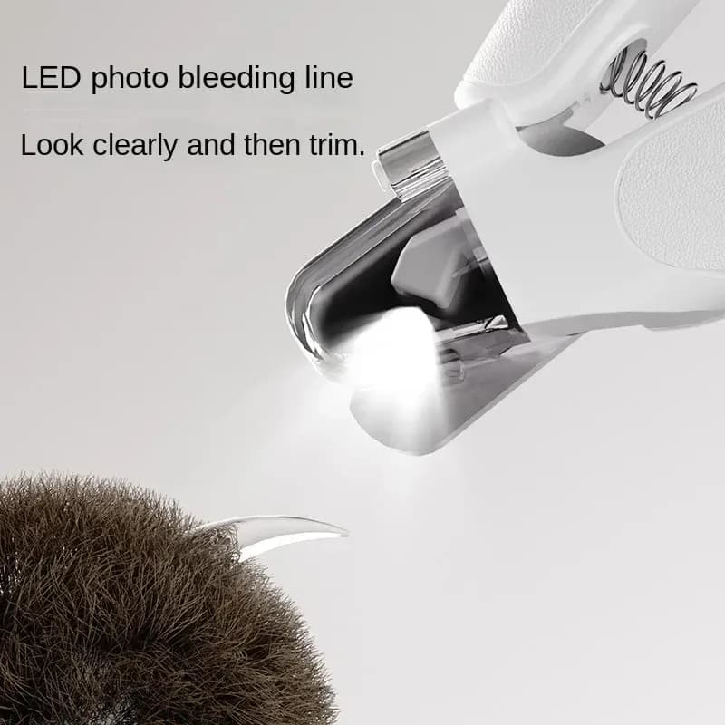 LED light shining on a pet nail through the clipper guard