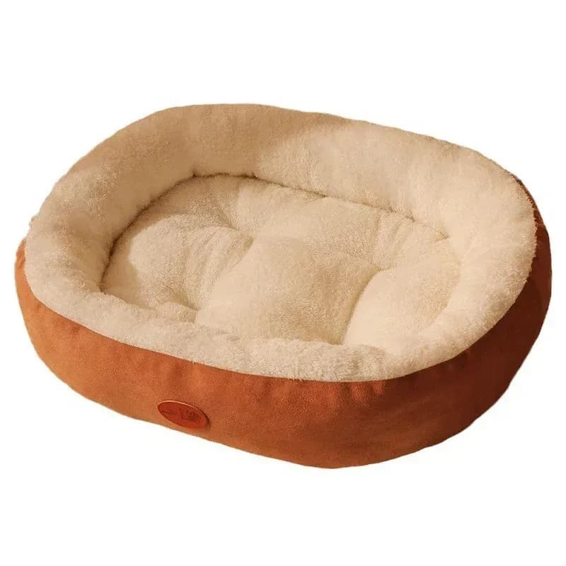 plush oval dog and cat bed in orange with cream faux fur lining