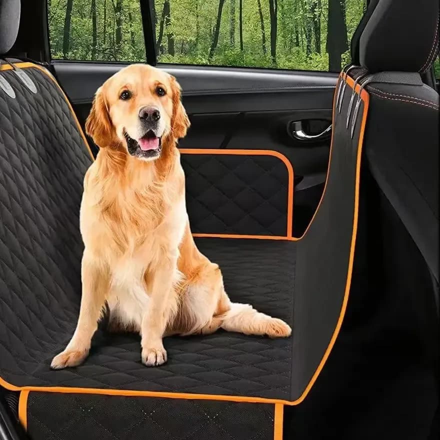 dog back seat cover in black with orange trim and a golden retriever